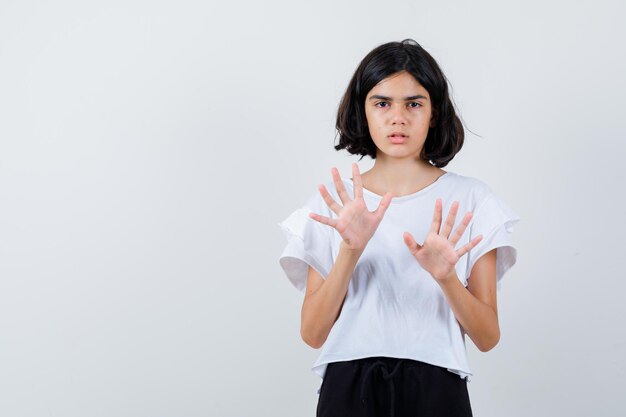 Expressive young girl posing in the studio