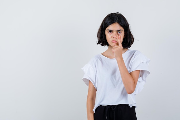 Expressive young girl posing in the studio