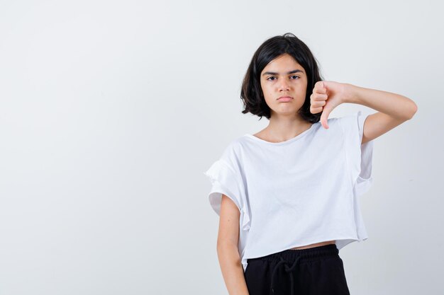 Expressive young girl posing in the studio