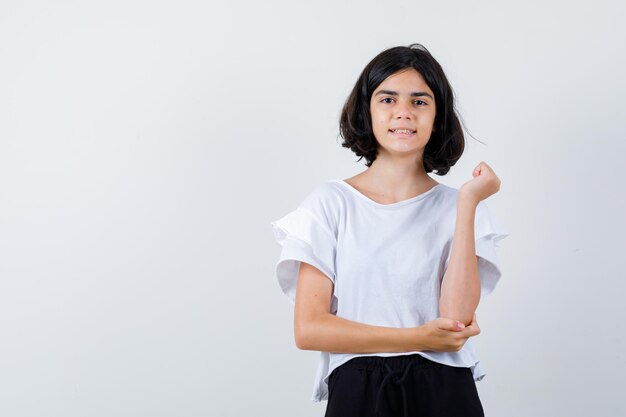 Expressive young girl posing in the studio