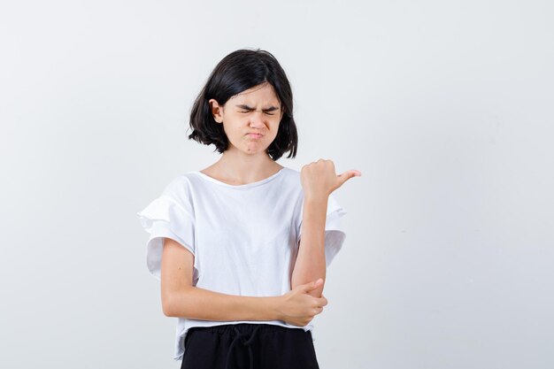 Expressive young girl posing in the studio