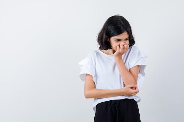 Expressive young girl posing in the studio