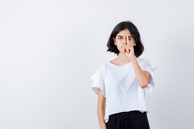 Expressive young girl posing in the studio