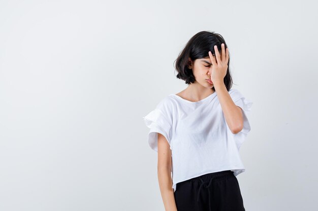 Expressive young girl posing in the studio