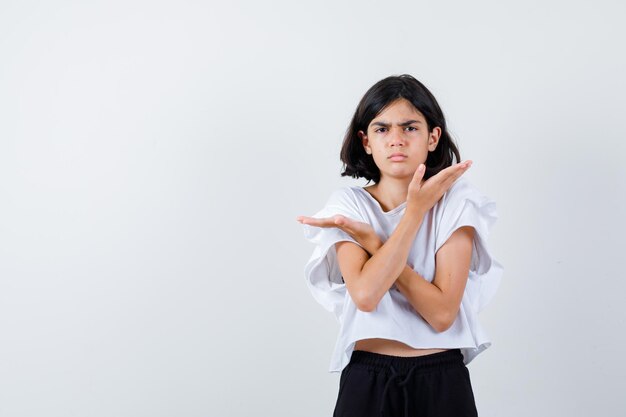 Expressive young girl posing in the studio