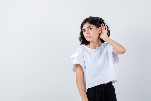 Expressive young girl posing in the studio