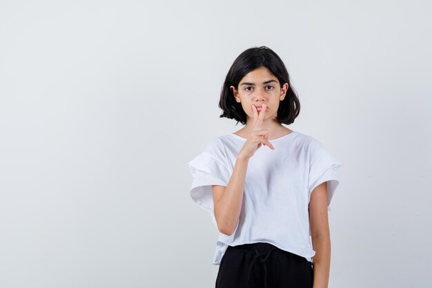 Expressive young girl posing in the studio