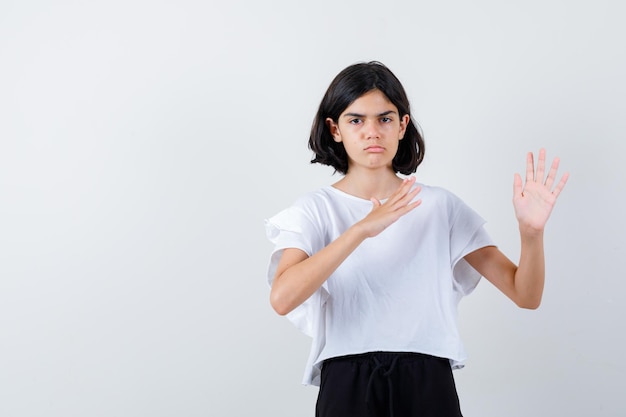 Expressive young girl posing in the studio