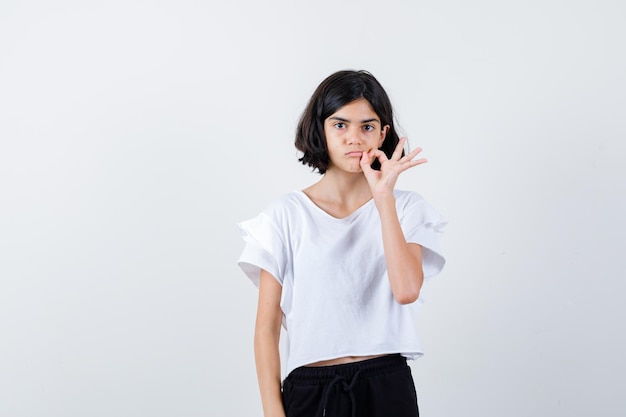 Expressive young girl posing in the studio