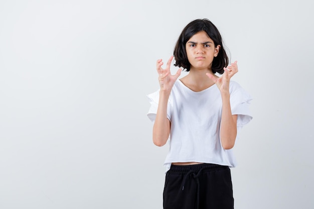 Expressive young girl posing in the studio