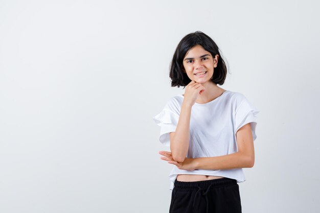 Expressive young girl posing in the studio