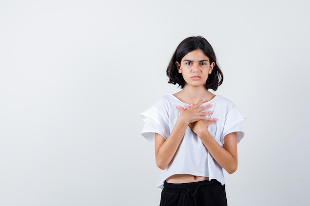 Expressive young girl posing in the studio