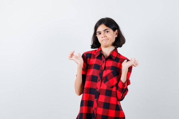 Expressive young girl posing in the studio