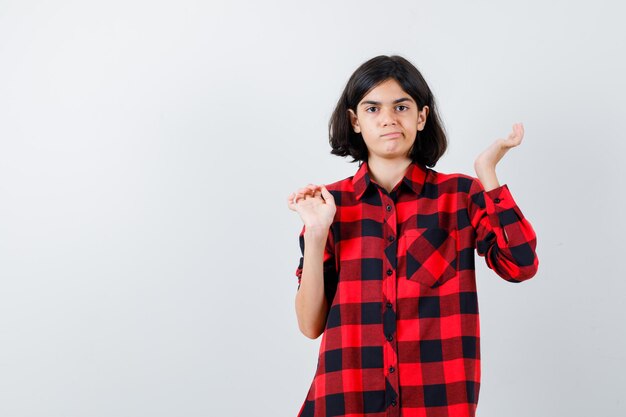 Expressive young girl posing in the studio