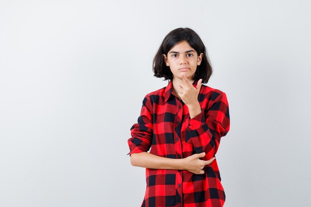 Expressive young girl posing in the studio