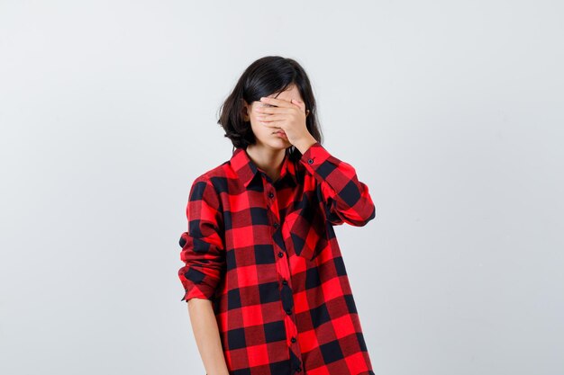 Expressive young girl posing in the studio