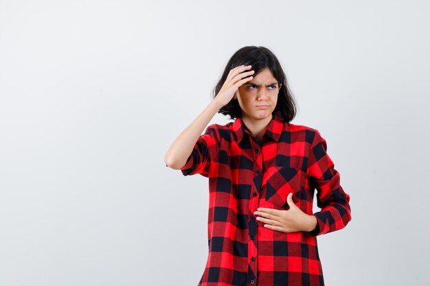 Expressive young girl posing in the studio