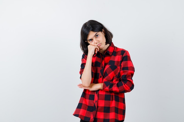 Expressive young girl posing in the studio