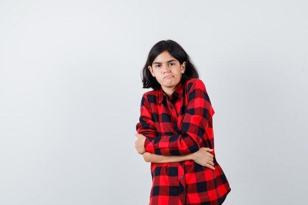 Expressive young girl posing in the studio