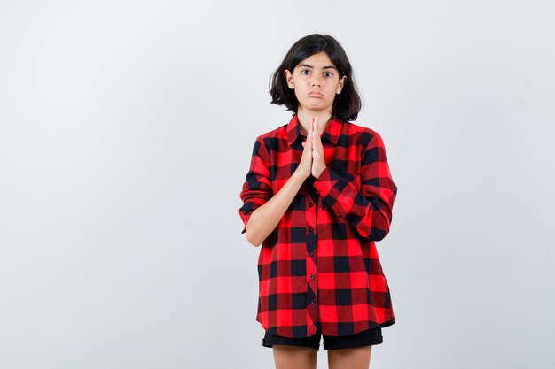 Expressive young girl posing in the studio