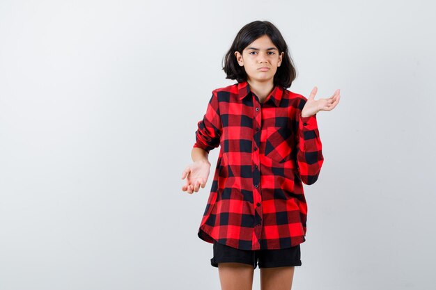 Expressive young girl posing in the studio