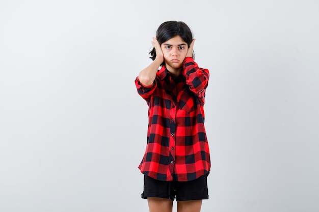 Expressive young girl posing in the studio