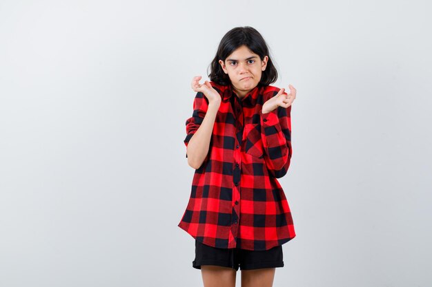 Expressive young girl posing in the studio