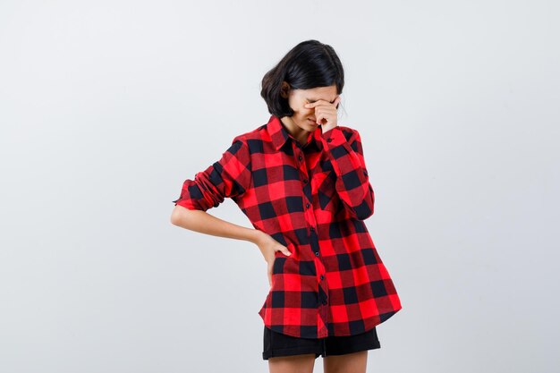 Expressive young girl posing in the studio