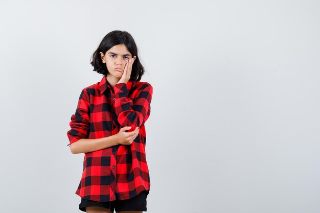 Expressive young girl posing in the studio