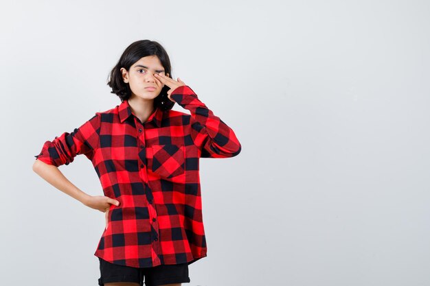 Expressive young girl posing in the studio