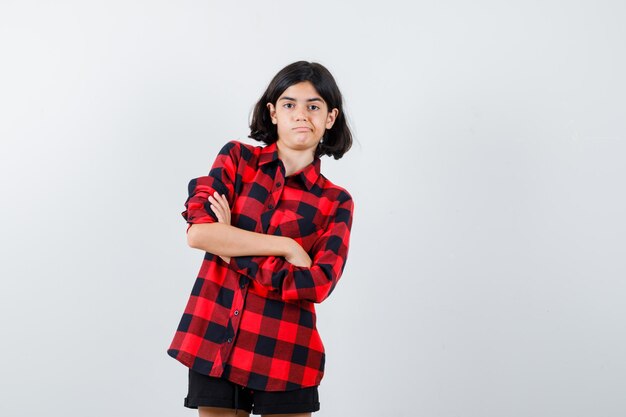 Expressive young girl posing in the studio