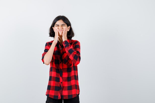 Expressive young girl posing in the studio