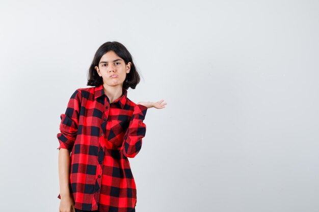 Expressive young girl posing in the studio