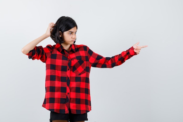 Expressive young girl posing in the studio