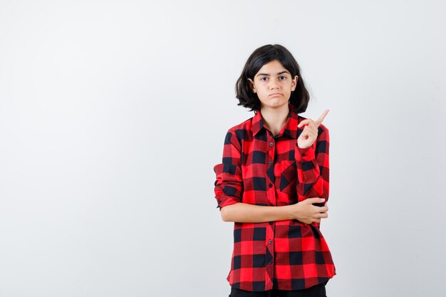 Expressive young girl posing in the studio