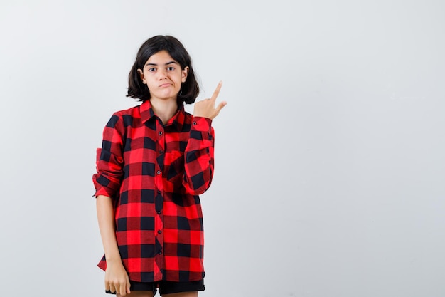 Expressive young girl posing in the studio