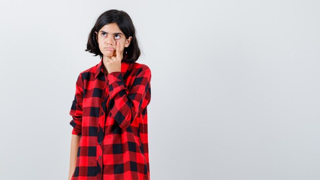 Expressive young girl posing in the studio