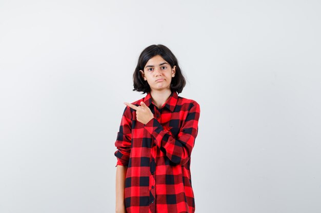 Expressive young girl posing in the studio