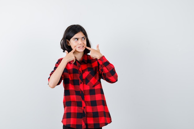 Expressive young girl posing in the studio