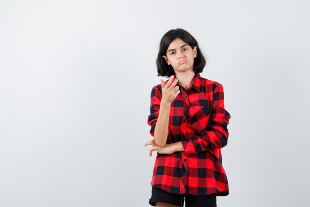 Expressive young girl posing in the studio