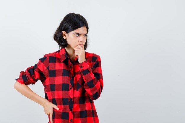 Expressive young girl posing in the studio