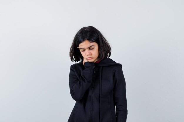 Expressive young girl posing in the studio