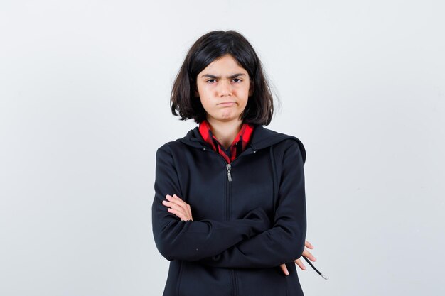 Expressive young girl posing in the studio