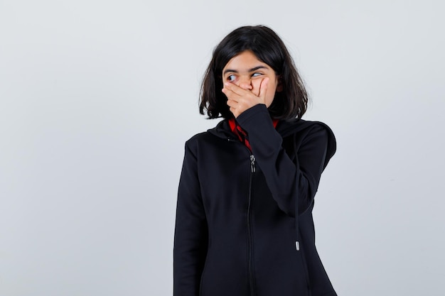 Expressive young girl posing in the studio