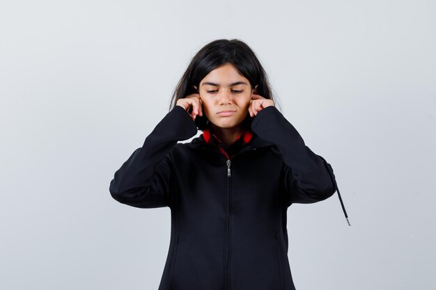 Expressive young girl posing in the studio