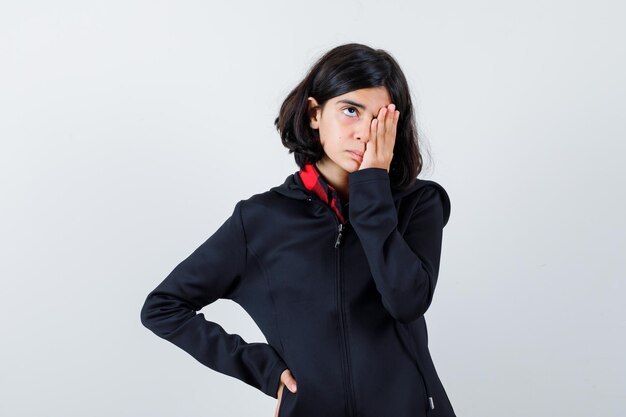 Expressive young girl posing in the studio