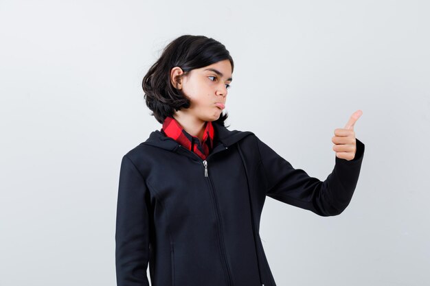 Expressive young girl posing in the studio