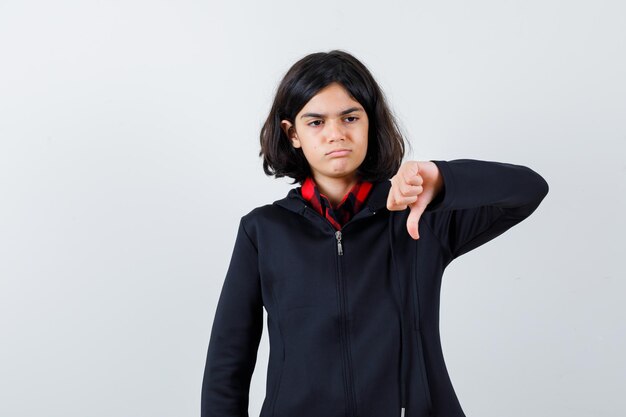 Expressive young girl posing in the studio