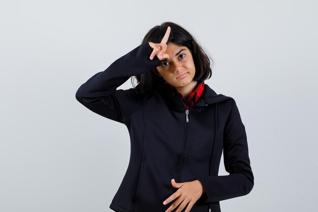 Expressive young girl posing in the studio