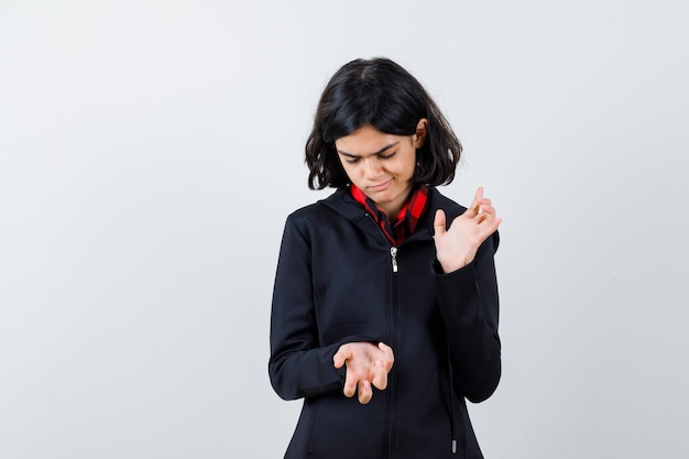 Expressive young girl posing in the studio